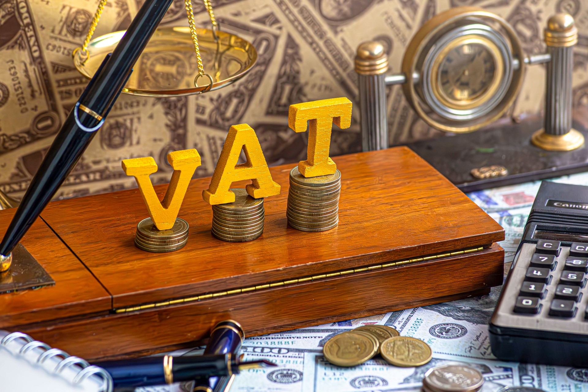 Stacking coins and gavel hammer with financial concept. tax vat law